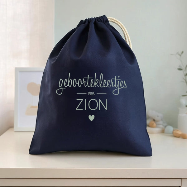 Bewaarzakje geboortekleertjes met naam